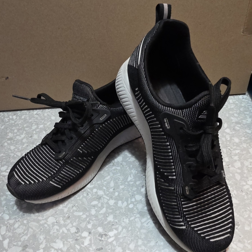 Women's Black and White Skechers Bobs Slip On Sneakers